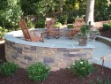 Bluestone patio with stone veneer sitting walls.