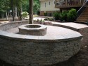 Raised circle paver patio with firepit