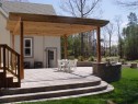 Pergola over paver patio with sitting walls